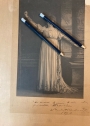 Real Photograph of Sarah Bernhardt, in role, possibly Tosca, holding knife aggressively, with signed inscription dated 1870.